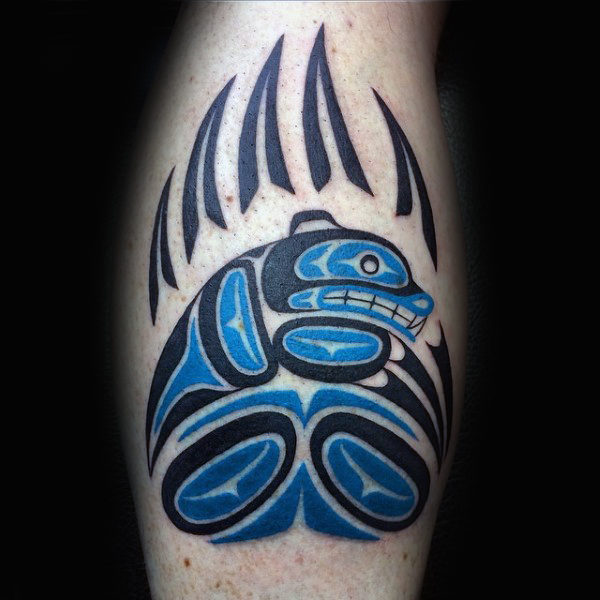 Guys legs black blue haida tattoo