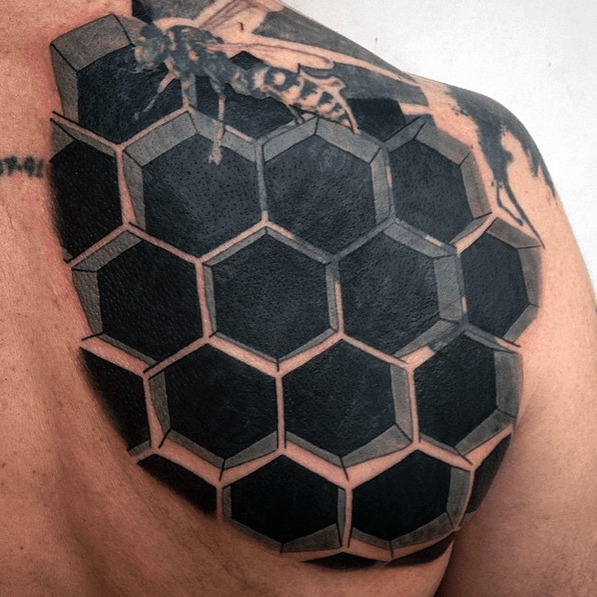 Honeycomb bee optical illusion mens back tattoo with black ink
