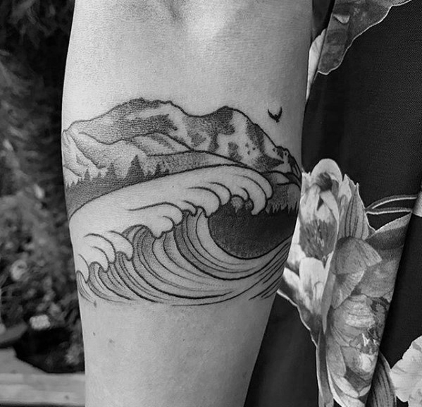 Impressive male mountain wave tattoo designs