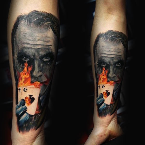 Joker with playing cards on fire mens tattoo