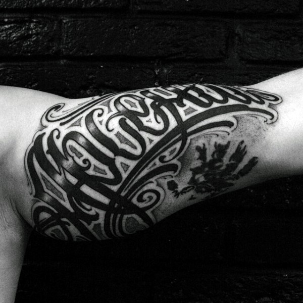 Male script graffiti inner arm tattoos with black ink