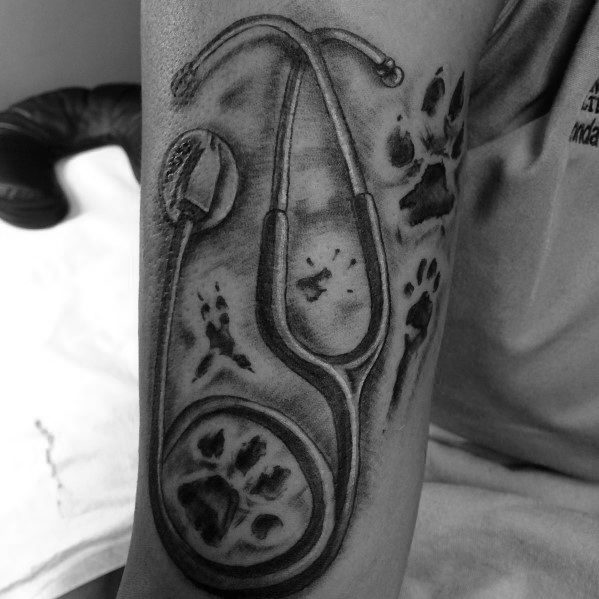 Male stethoscope dog paw themed tattoo inspiration