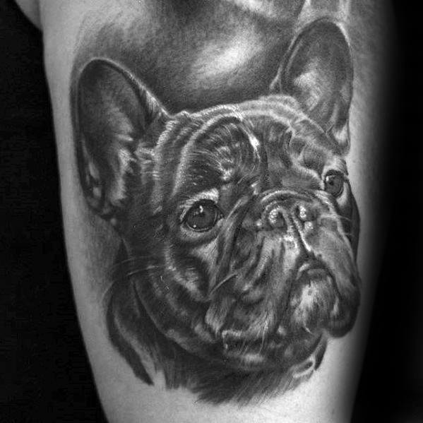 Male tattoo with portrait dog design on arm
