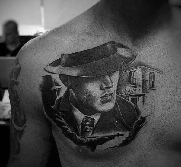 Male with gangster upper chest portrait tattoo