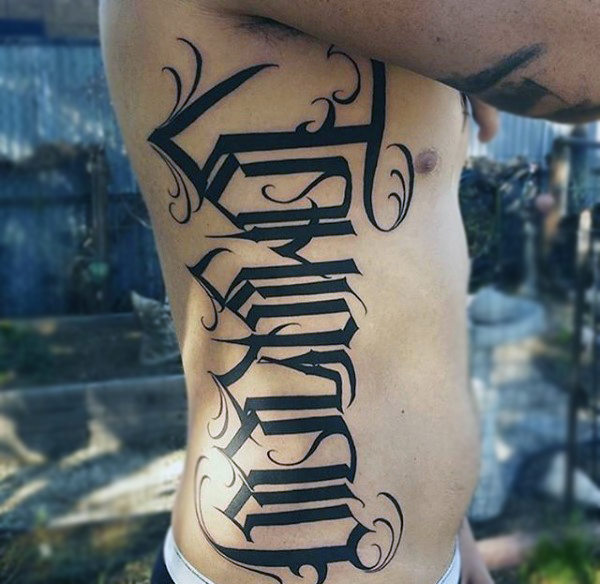 Males torso arabic style lettering tattoo