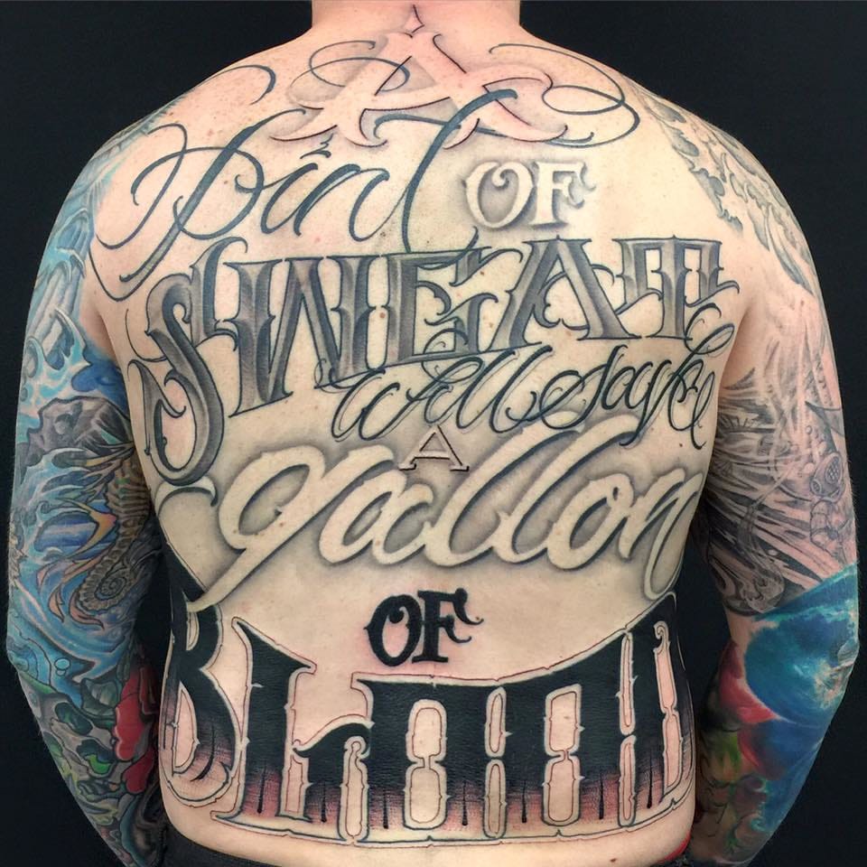 Man full back letter tattoo