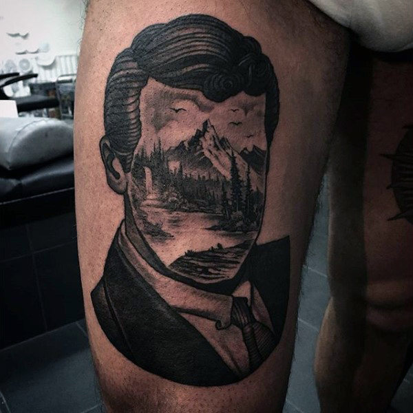 Man with abstract portrait with forest as face thigh tattoo
