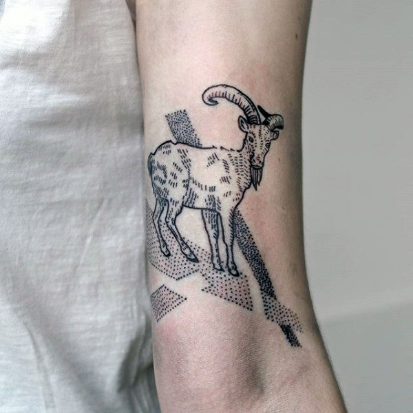 Man with capricorn goat dotwork tattoo on inner arm