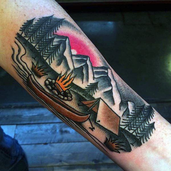 Man with forearm tattoo tent and boat