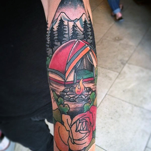 Man with modern campsite and flower tattoo half sleeve