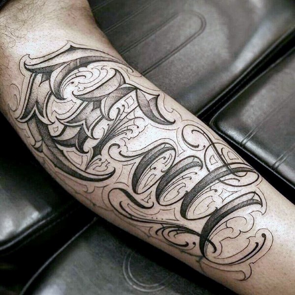Man with script cali tattoo on arm