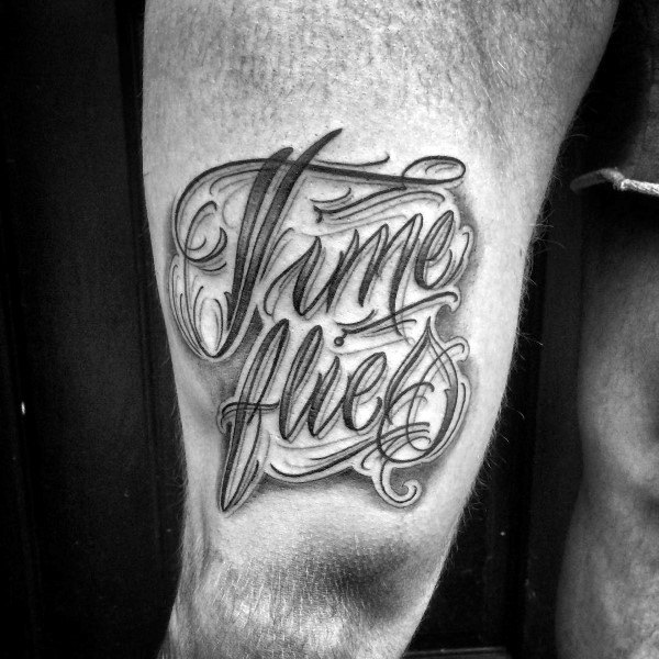 Man with script tattoo on thigh time flies