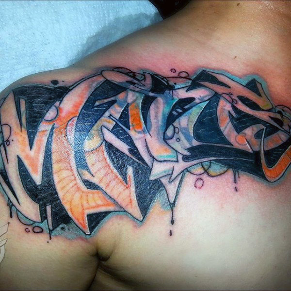 Man with shoulder graffiti tattoo