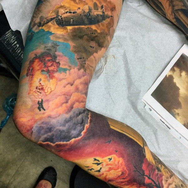 Masculine military plane fire sky sleeve tattoo ideas