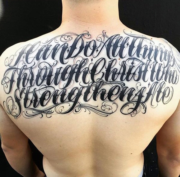 Mens back curly lettering tattoo