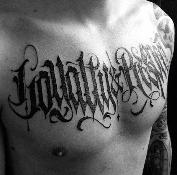 Mens chest horror lettering tattoo