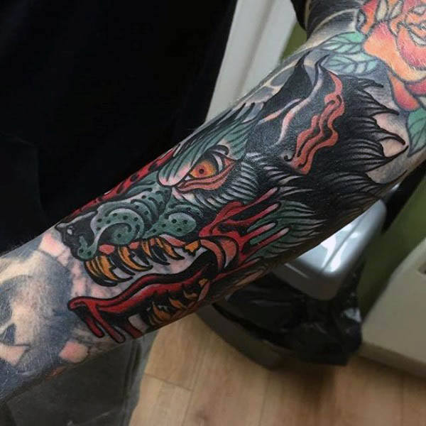 Mens forearms angry animal neo traditional tattoo