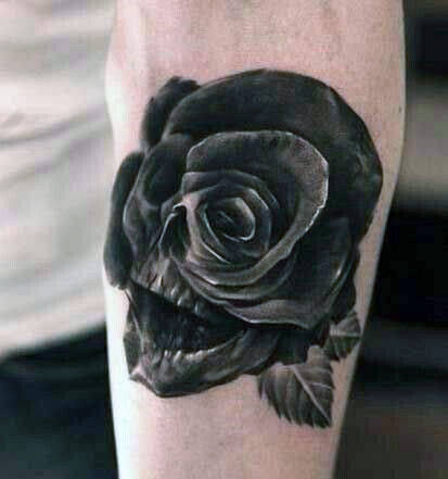 Mens rose skull small optical illusion black ink tattoo on forearm