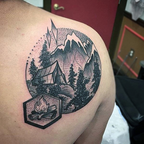 Modern camping scene of tend in woods back tattoo on man