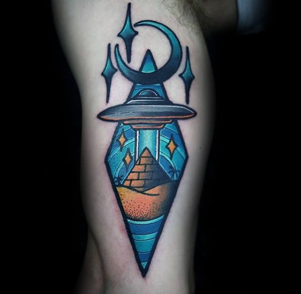 Moon and stars with spaceship and pyramid guys leg tattoo