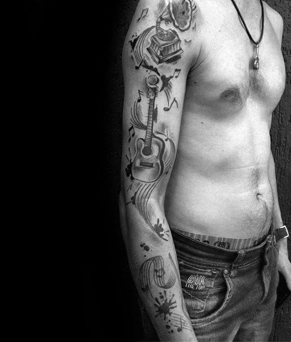 Music staff tattoo arm sleeve design inspiration