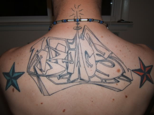 Nautical stars and graffiti tattoo on man upper back