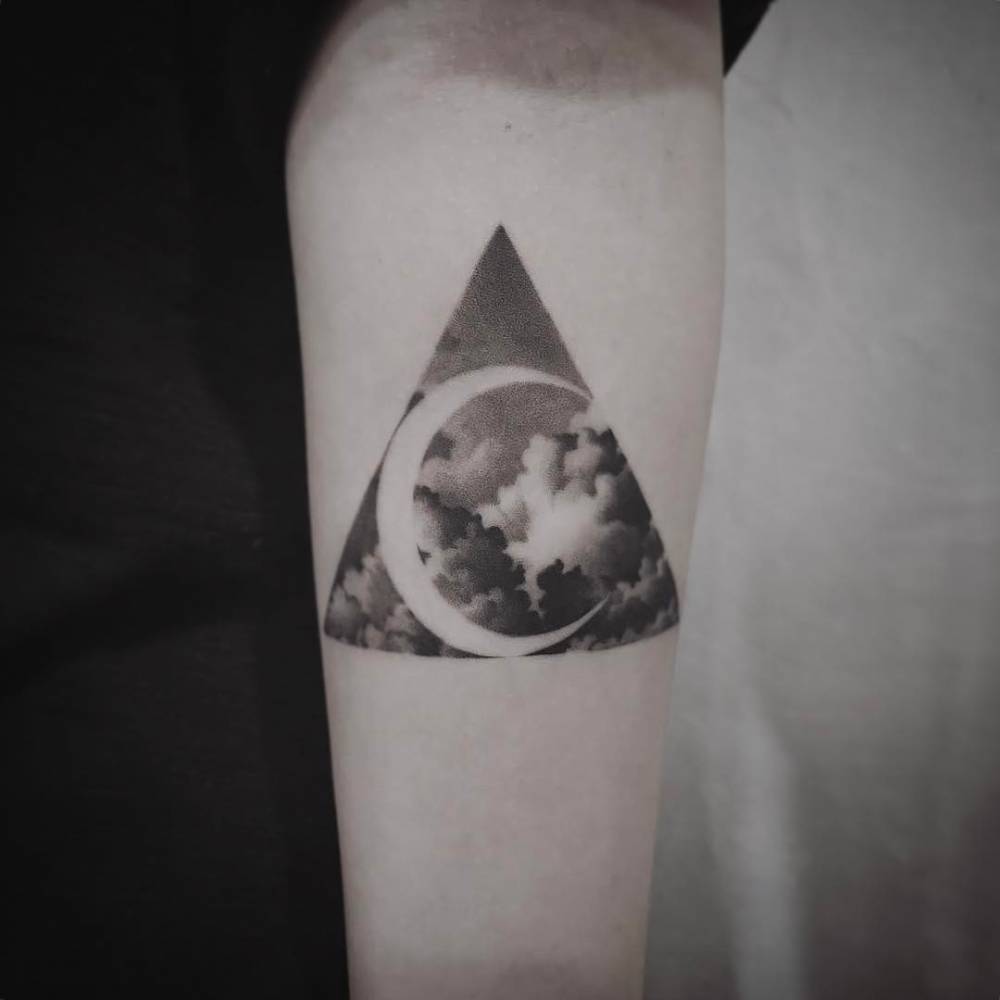 Negative Space Crescent Moon And Clouds Tattoo