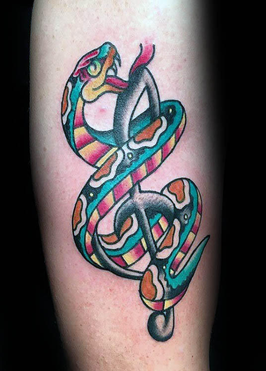 Old school snake treble clef mens arm tattoo idea