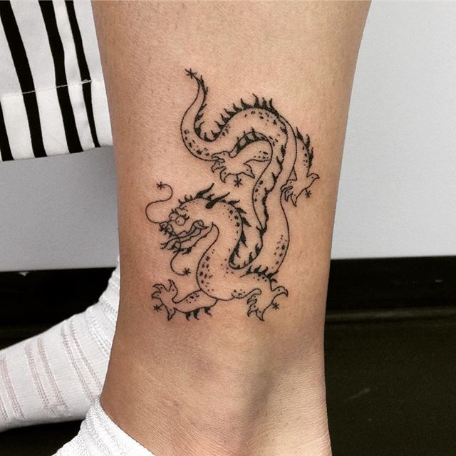 Outline-dragon-tattoo-on-the-ankle