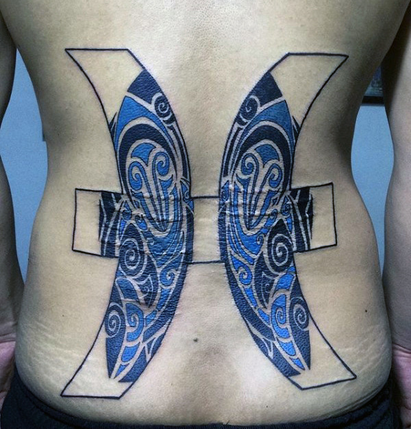 Pisces guys lower back tattoo design with blue ink tribal fish