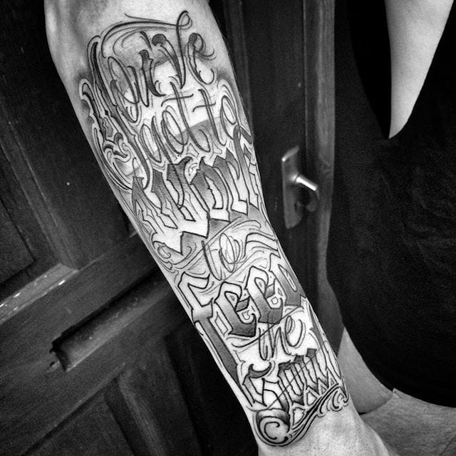 Right arm Lettering tattoo