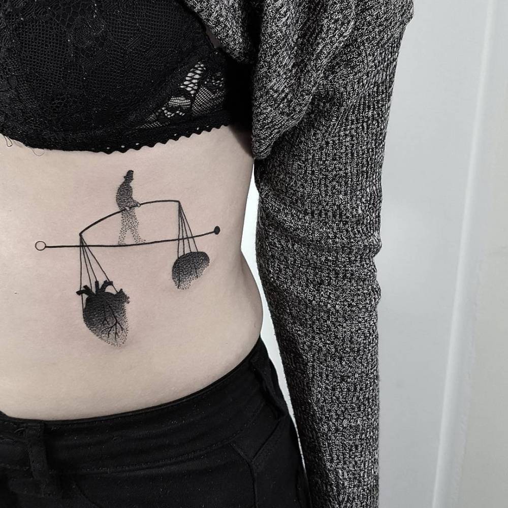 Scales Tattoo On The Belly