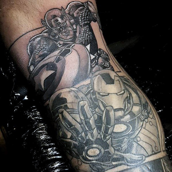 Shaded black and grey marvel inner arm bicep tattoo ideas for men