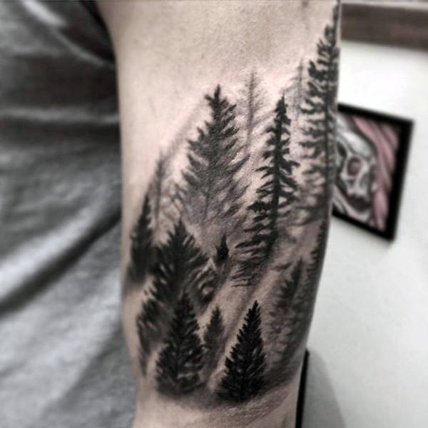 Simple black work pine forest in mist tattoo on gentleman