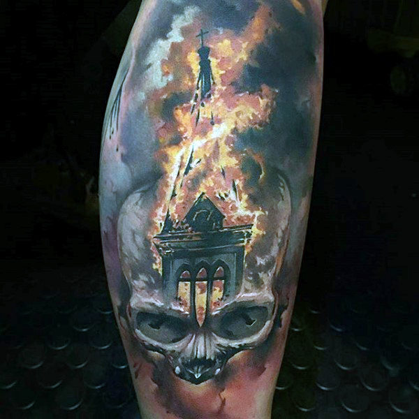 Skull with church roof mens fire tattoo on leg