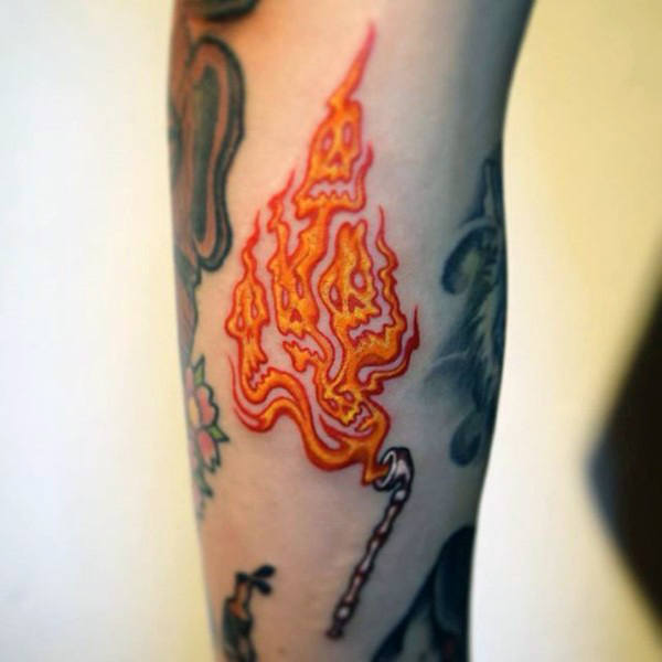 Small fire gas skulls mens arm tattoo