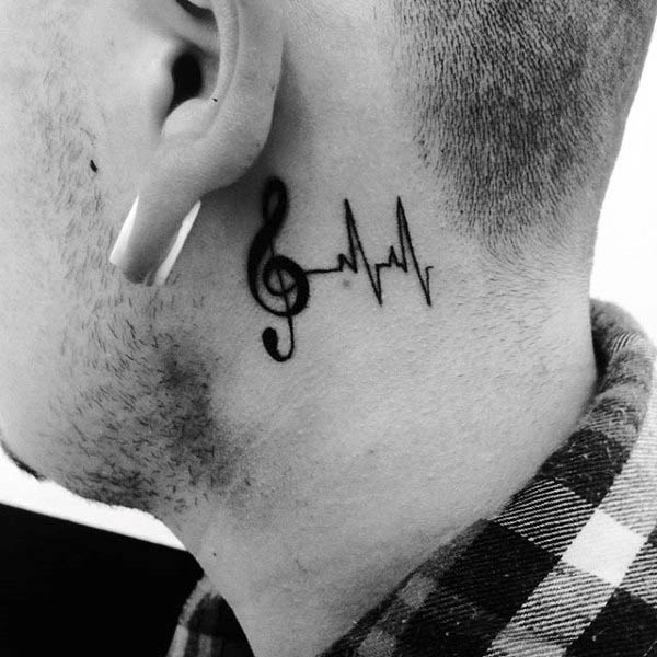 Small simple treble clef behind the ear tattoos for males