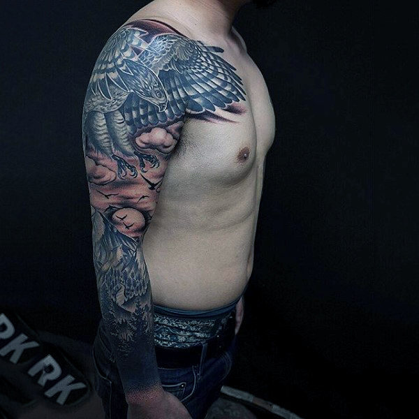 Swooping hawk full sleeve in modern style tattoo on gentleman