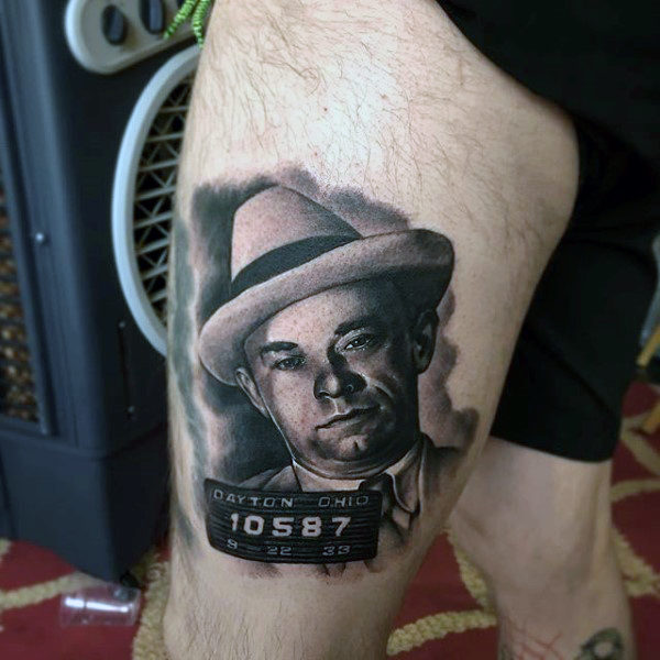 Thigh gangster portrait tattoo on man