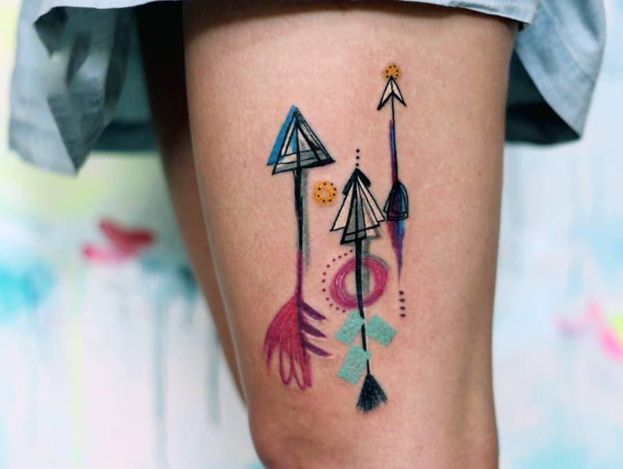 Three Watercolor Arrow Tattoos On The Left Thigh