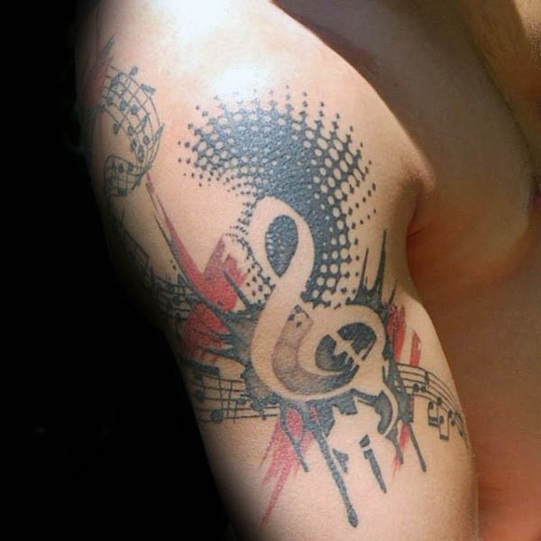 Trash polka treble clef upper arm guys tattoo