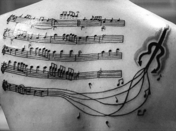 Upper back music staff guy tattoo design
