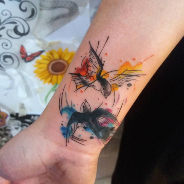 Wrist bird watercolor tattoo