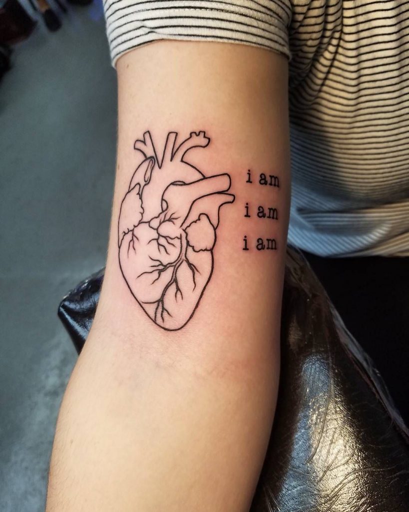 Girl right upper arm medical tattoo