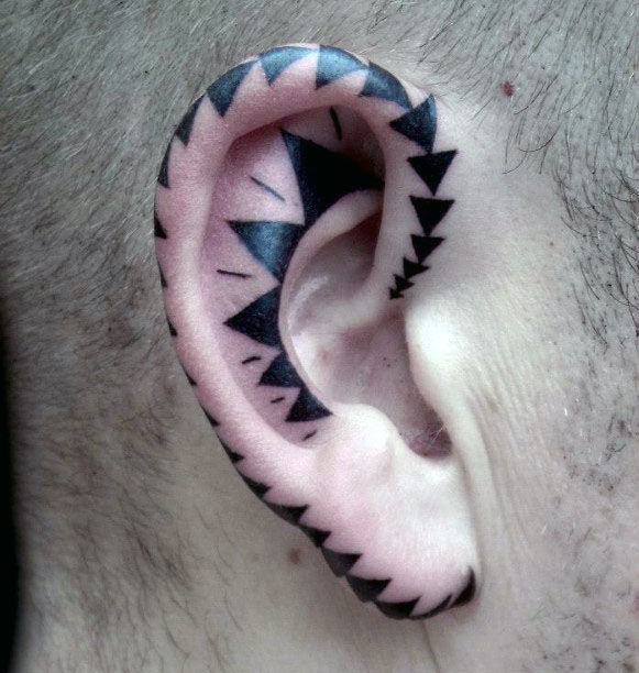 Aamazing mens ear tattoo of solid black ink triangle pattern