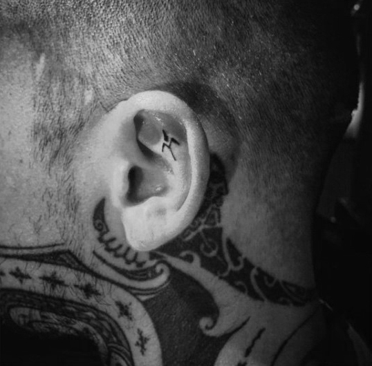 Awesome male tribal ear tattoo design inspiration