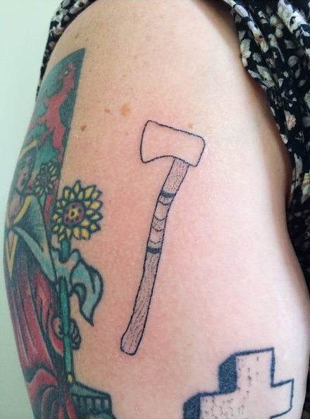 Axe Tattoo On The Right Hip