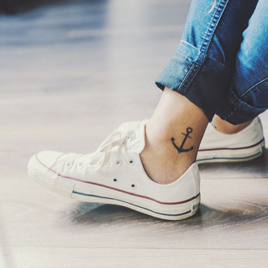 Black Anchor Tattoo On The Right Inner Ankle