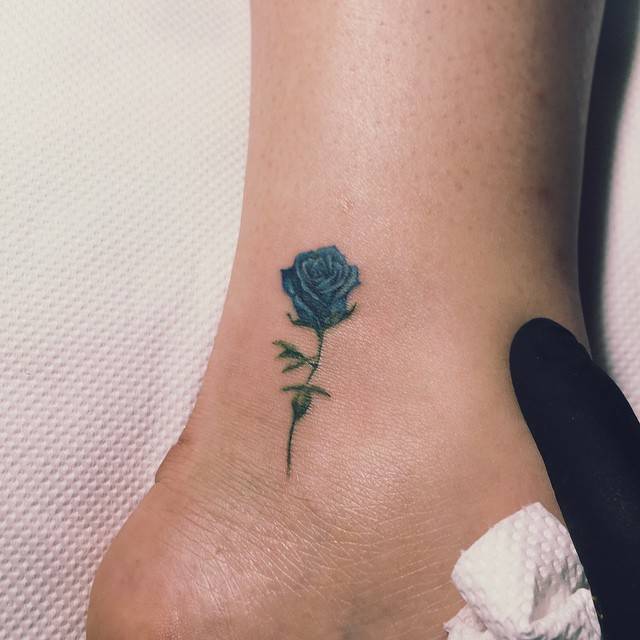 Blue Rose Tattoo On The Outer Ankle