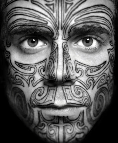 Cool tribal patterned male face tattoo design ideas